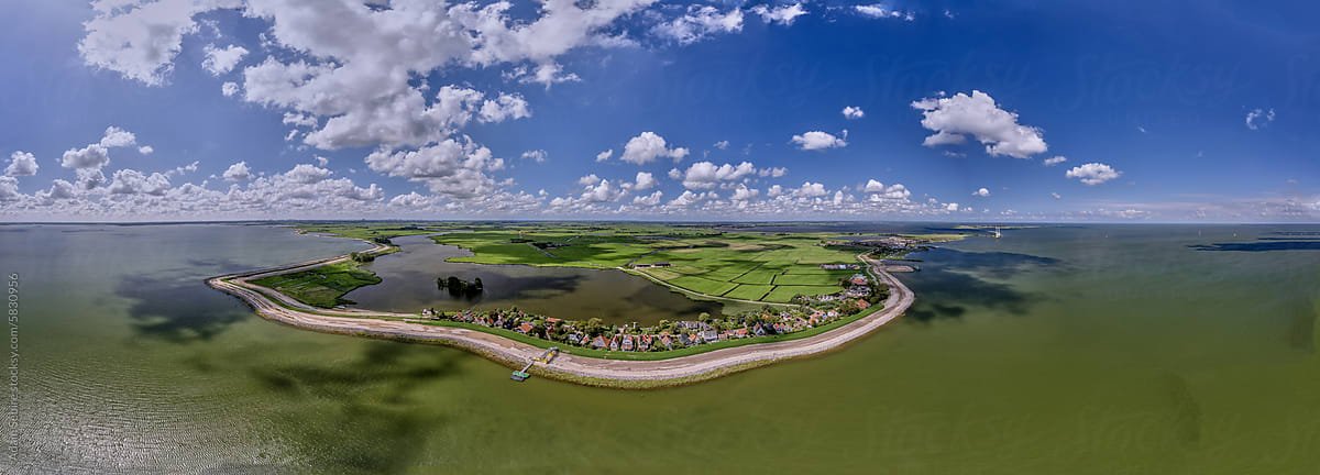 Drone aerial panorama of Markermeer dyke (dike) terraforming Uitdam, Holland, Netherlands, protecting low-lying polder farmland and villages. (Drone aerial panorama of Markermeer dyke (dike) terraforming Uitdam, Holland, Netherlands, protecting low-ly